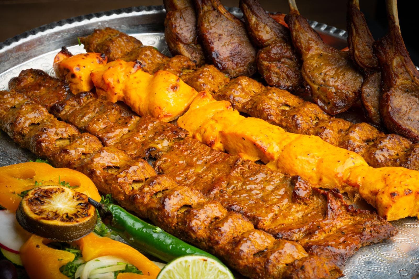 Charcoal grilled Persian chicken kebab on a platter